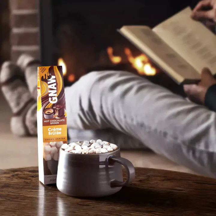 Rich, smooth, thick and creamy hot chocolate. Hot milk pouring over chocolate bombes