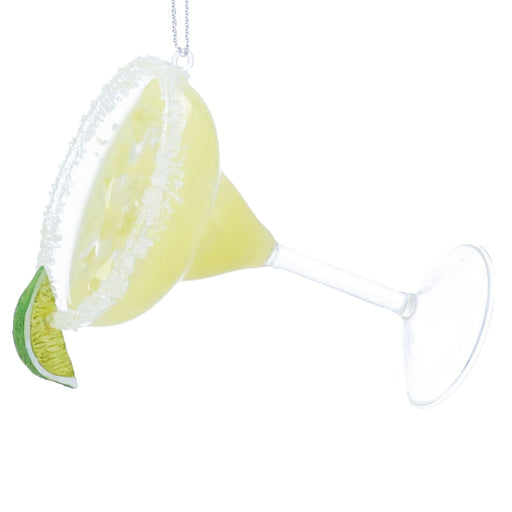 Decorative lemon and lime slice with a cone-shaped object on a white background