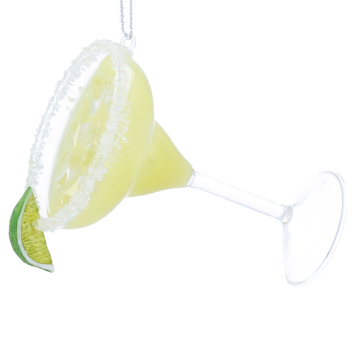 Decorative lemon and lime slice with a cone-shaped object on a white background