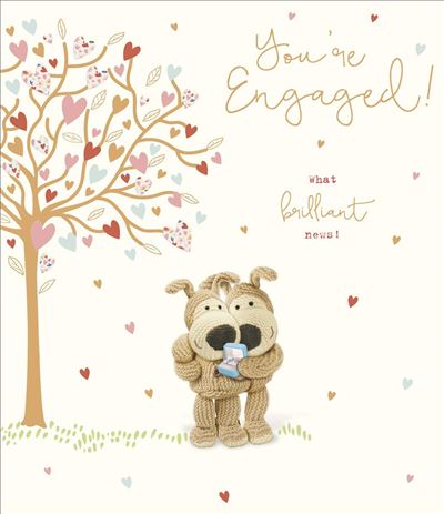 Card with a cartoon dog holding a baby shower gift, heart tree, and text 'You're Engaged! What brilliant news!' on a white background.