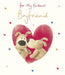 Card with two dog toys inside a heart shape and 'For My Brilliant Boyfriend' text on a white background.