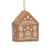 Decorative gingerbread house ornament on a white background