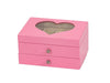 A pink wooden jewelry box with two drawers and a heart-shaped window on the lid, shown on a plain white background.