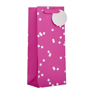 A bright pink gift bag with white polka dots and a matching pink handle, shown on a plain white background.