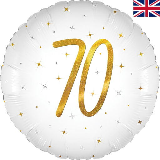 A round white foil balloon with a large glittery gold number 70 in the center, decorated with scattered gold and silver star accents. A small Union Jack flag icon is visible in the top right corner.