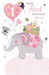 A baby first birthday card featuring a cute pink and gray elephant carrying a basket of baby items, with a pink heart-shaped balloon that says '1' and the text 'Happy First Birthday little one' on a white background.