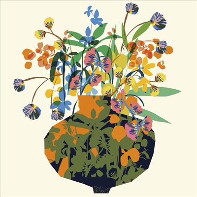 Colorful floral arrangement in a patterned vase on a light beige background