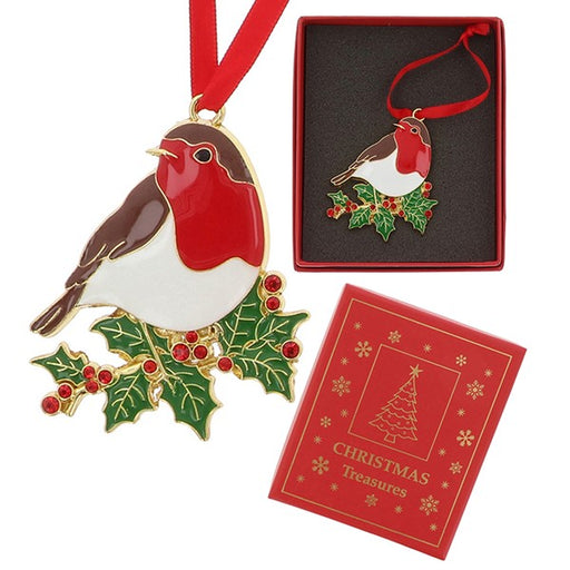 A robin Christmas ornament with gold-tone metal detailing, red, white, and brown enamel, and green holly with red berries, shown alongside its red gift box and a red branded presentation box on a white background.