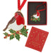 A robin Christmas ornament with gold-tone metal detailing, red, white, and brown enamel, and green holly with red berries, shown alongside its red gift box and a red branded presentation box on a white background.