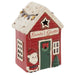 A Christmas-themed ceramic ornament shaped like a red cabin labeled 'Santa's Grotto,' with a white snow-covered roof, green door, Santa figure, and small tree on a white background.