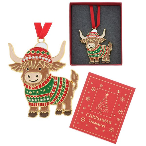 A Highland cow Christmas ornament with a red and green knit sweater and hat, shown alongside its red gift box and a red card labeled Christmas Treasures, on a white background.