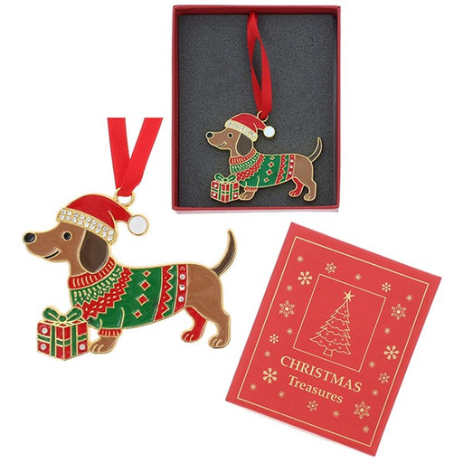 A Christmas dachshund ornament shown with its red gift box, a red hanging ribbon, and a red card labeled Christmas Treasures on a white background.