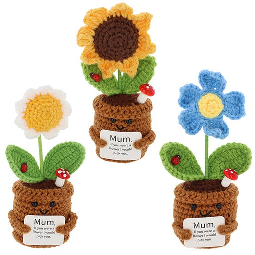 Three crocheted flower pot characters on a plain white background. Each has a small brown crocheted pot with a card that says 'Mum.