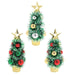 Three small artificial Christmas trees in gold-colored planters, decorated with green, red, and silver ornaments and topped with gold star trees, shown on a plain white background.