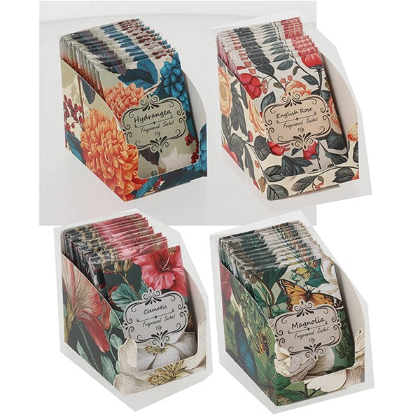 Four display stands holding small packets of botanical tea, each packet featuring a different floral and butterfly illustration. The stands are arranged on a white background.
