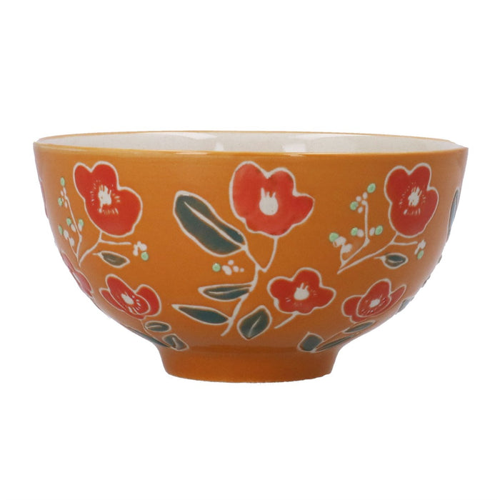 An orange ceramic bowl decorated with a hand-painted floral pattern of red flowers and green leaves, shown against a plain white background.