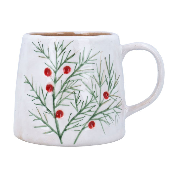 White mug with green leaf pattern and red berries on a white background