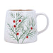 White mug with green leaf pattern and red berries on a white background
