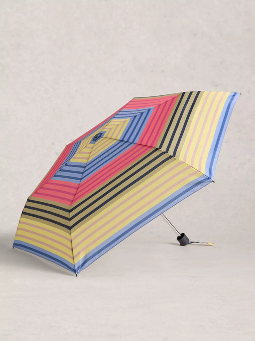 Colorful striped umbrella on a light gray background