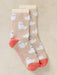 A pair of beige crew socks with a repeating pattern of fluffy white cartoon sheep and small pink hearts, finished with coral pink toes and heels.