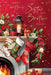 A festive Christmas-themed graphic with the text 'Happy Christmas Sister and Brother - In-Law' on a red background. The scene shows a decorated fireplace mantel with three hanging stockings, a lantern, wrapped gifts, poinsettias, and a burning fire.