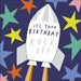 Rocket ship with 'It's Your Birthday Rock-It!' text on a colorful star background
