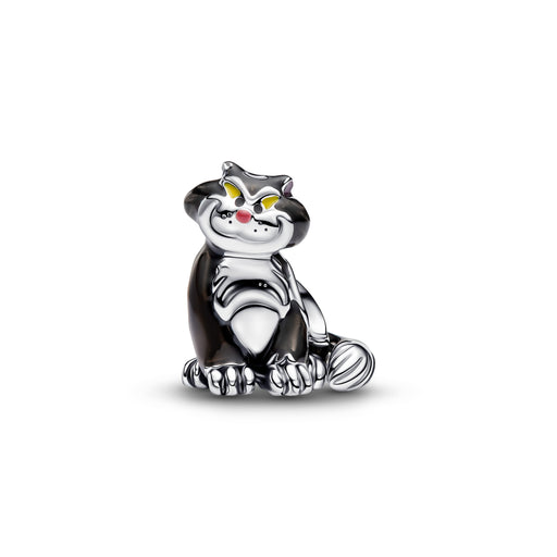 A small metallic cat charm or pendant in a sitting pose, with a polished silver-tone finish, black enamel sections, yellow eyes, and a tiny red nose, shown on a plain white background.