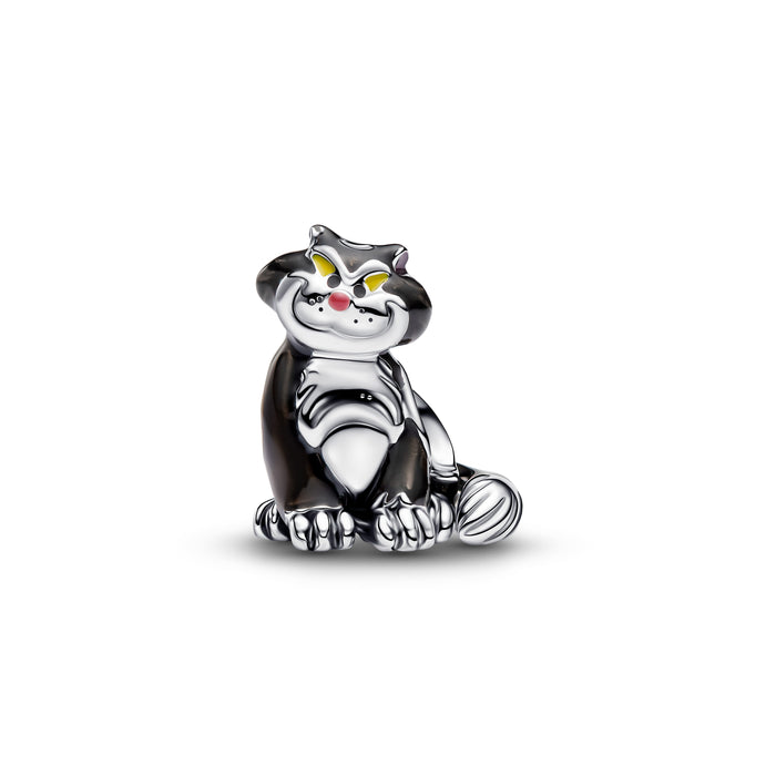 A small metallic cat charm or pendant in a sitting pose, with a polished silver-tone finish, black enamel sections, yellow eyes, and a tiny red nose, shown on a plain white background.
