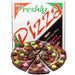 A novelty chocolate and bean pizza toy set with a sliced chocolate pizza in front of its colorful retail box. The toy pizza is made of dark brown chocolate with white drizzle and colorful candy-coated beans, set against a plain white background.