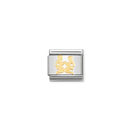 Silver and gold charm on a white background