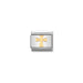 Silver and gold cross charm on a white background