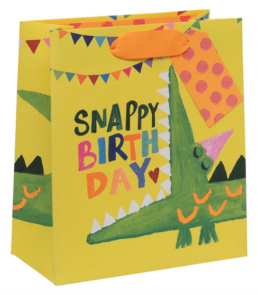 Gift bag with crocodile design and 'Snappy Birthday' text on a yellow background