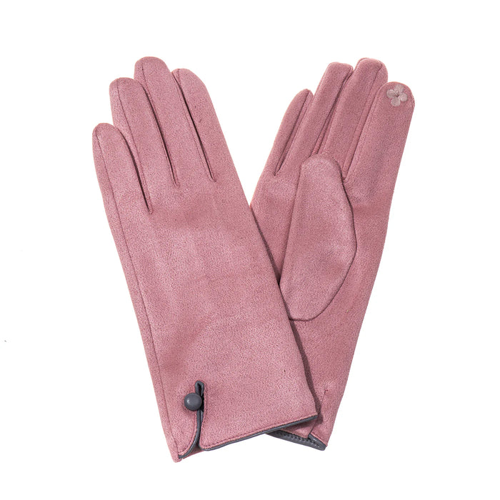 A pair of dusty rose pink leather gloves with a small black button detail on the cuff and a tiny white embroidered flower on one glove, displayed against a solid white background.