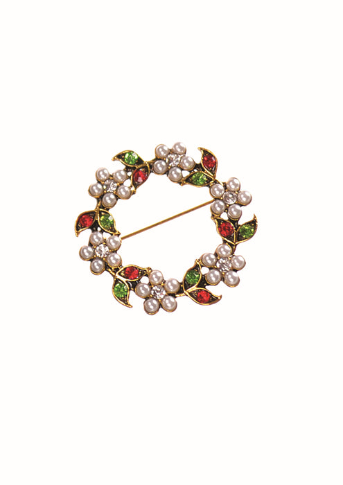 A circular gold-tone brooch featuring clusters of white faux pearls and green and red enamel leaves, shown on a plain white background.