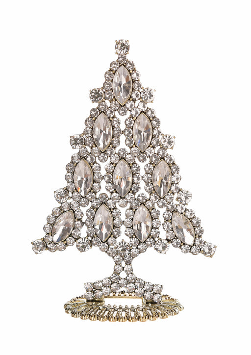 A Christmas tree-shaped brooch or decorative piece made of clear marquise and round crystals set in a silver-toned metal, with a gold-toned base, shown on a plain white background.