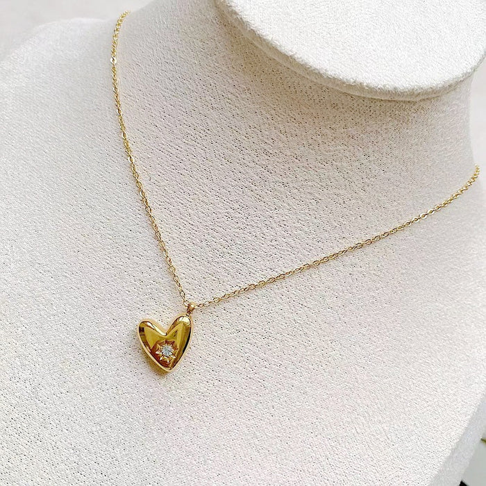 White Leaf Cubic Zirconia Inset Hanging Heart Necklace In Gold