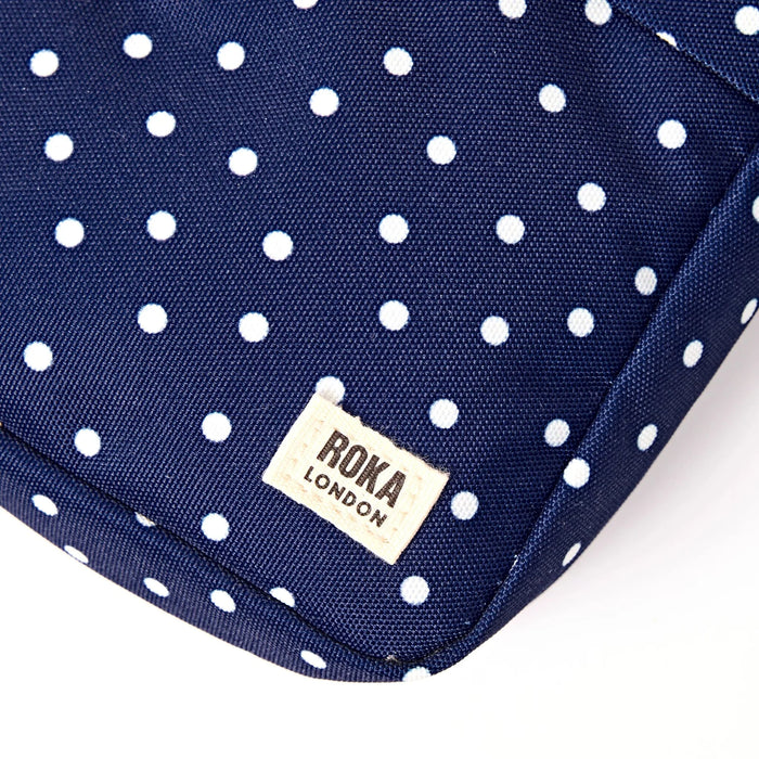ROKA Bond Pocket Crossbody Bag in Navy Polka Dot