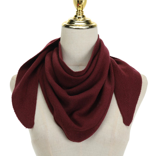 Maroon scarf on a mannequin with a white background