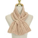 Beige knitted scarf on a mannequin with a white background