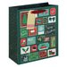 A dark green Christmas advent gift bag with a festive collage of holiday illustrations on the front panel, including stockings, snowflakes, candy canes, and 'Merry Christmas' cards. It has a red handle and a blank beige hang tag attached.