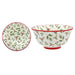 A white ceramic bowl with a festive holly and berry pattern, shown from two angles: a flat top-down view on the left and a side profile on the right. The bowl features a red rim and base, with green holly leaves and red berries printed all over.