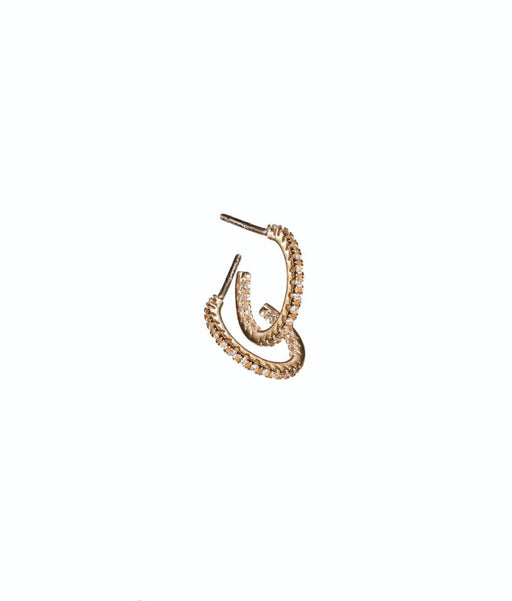Gold hoop earring on a white background with 'fine & delicate' text.