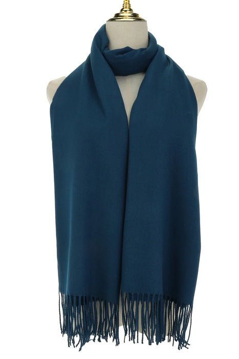 Navy blue scarf with fringes on a mannequin against a white background