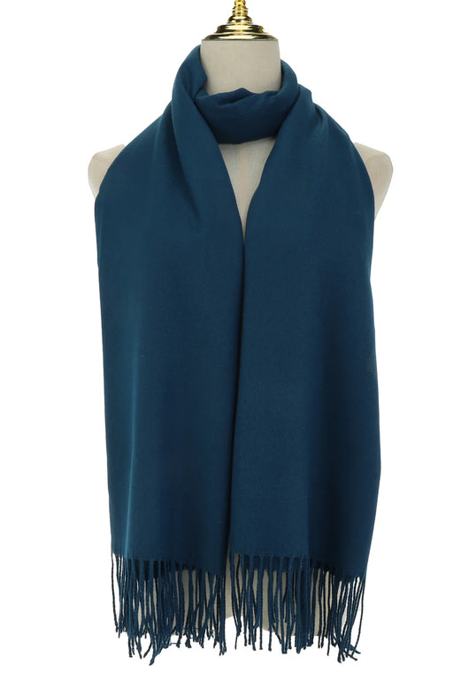 Navy blue scarf with fringes on a mannequin against a white background