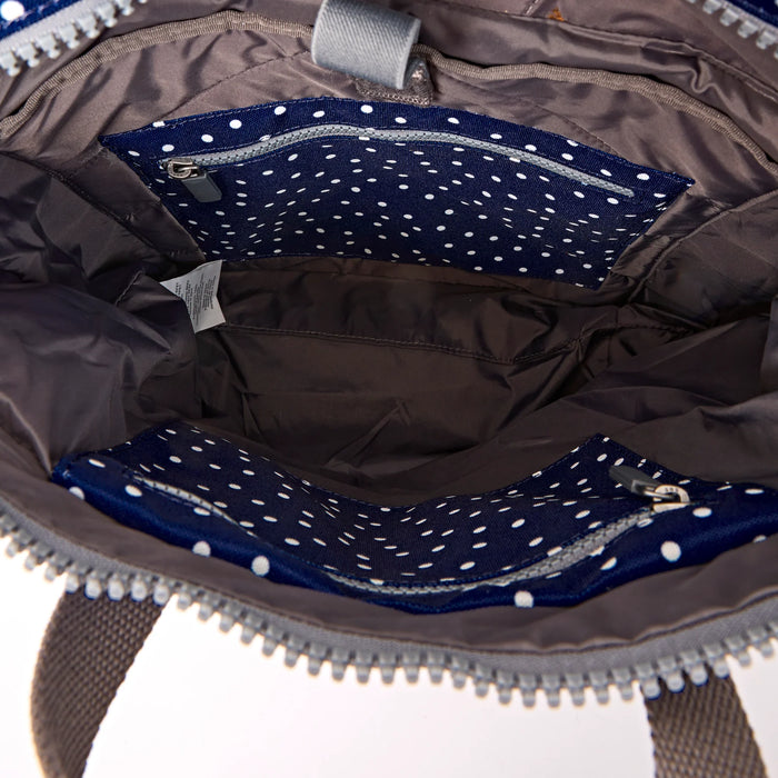 ROKA Bags Canfield Roll Top Backpack in Navy Polka Dot