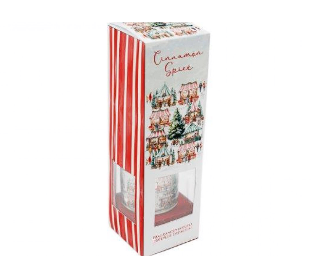 A boxed candle labeled 'Cinnamon Spice' with red-and-white vertical stripes on the left side and a holiday village illustration on the front, shown on a plain white background.