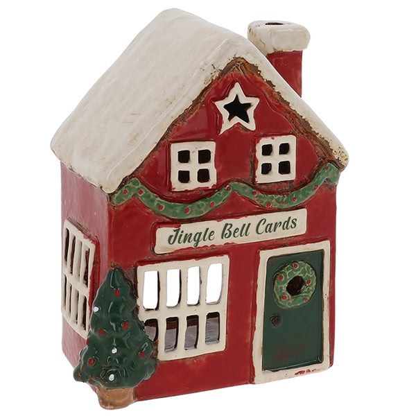 Red ceramic house-shaped card holder with 'jingle bell cards' text on a white background